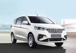 Maruti Ertiga air-conditioned taxi cab available for airport transfers, outstation trips, and local travel in Amritsar, Dharamshala, Chandigarh, Ludhiana, Jalandhar, and New Delhi.