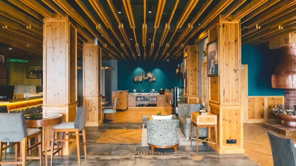 Cozy hotel interior in Dalhousie with wooden walls, stylish furniture, and luxurious mountain accommodation.