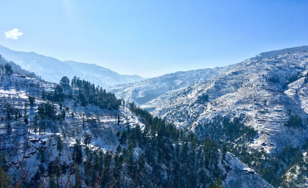 Winter view of Shimla hills covered in snow with majestic Himalayan mountains
