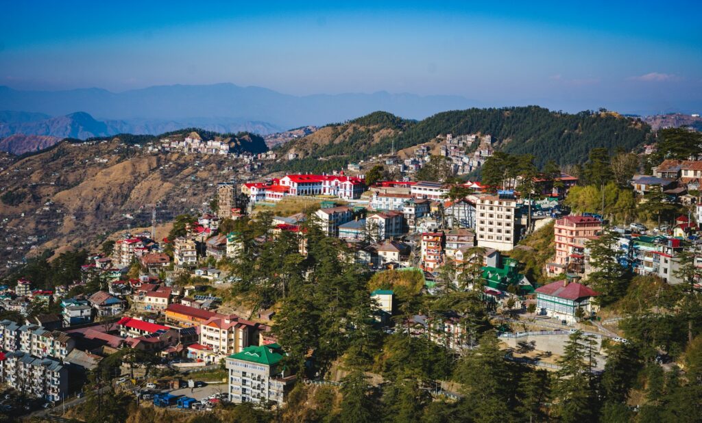 Beautiful panoramic landscape of Shimla hills with green valleys and residential houses