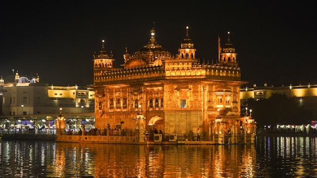Golden Temple Amritsar illuminated at night with reflection in sacred water