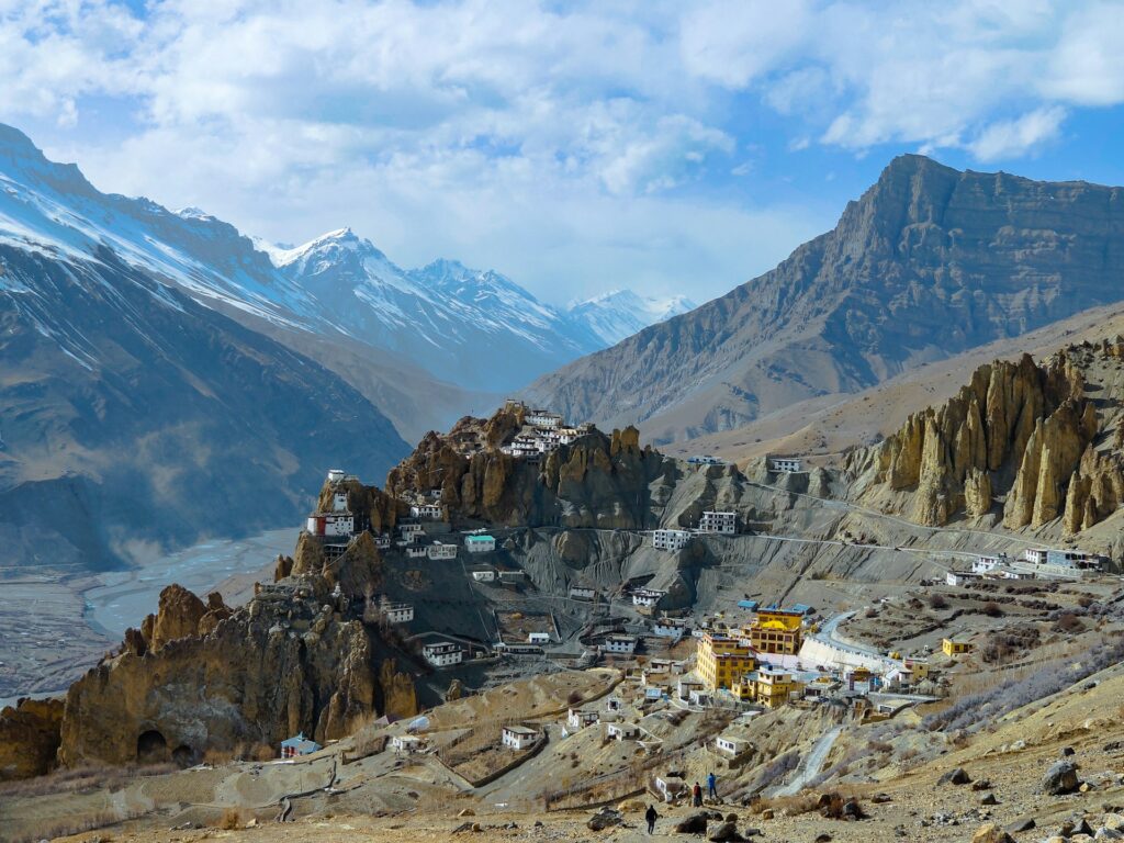 Scenic hillside homes in Spiti Valley surrounded by majestic mountains