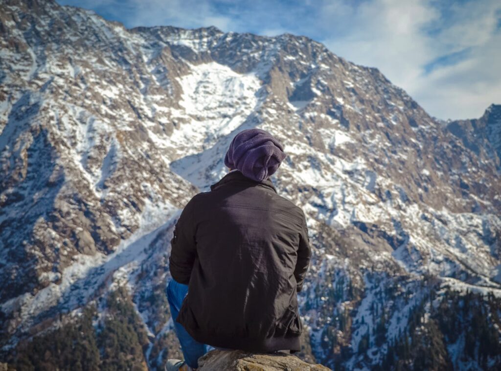 Snow-covered mountain track route to Dharamshala with scenic Himalayan road view, captured during winter travel for Visit Taxi Service offering taxi booking, airport transfers, and outstation cab services in Amritsar, Dharamshala, Chandigarh, Ludhiana, New Delhi, and Jalandhar.